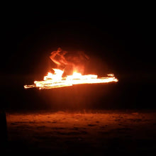 Load image into Gallery viewer, long exposure shot of fire performer spinning flaming hula hoop
