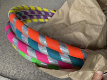 Load image into Gallery viewer, rainbow hoops in environmentally friendly packaging