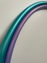 Load image into Gallery viewer, teal and purple hula hoops nesting

