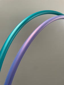 teal and purple hula hoops side by side