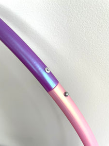 close up of pink and purple hula hoop opening mechanism