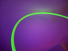 Load image into Gallery viewer, glow in the dark hula hoop under a UV light
