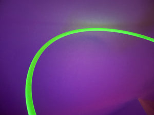 glow in the dark hula hoop under a UV light