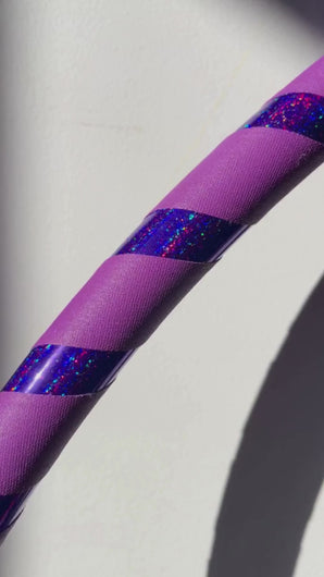 close up of glitter hula hoop with purple grip tape
