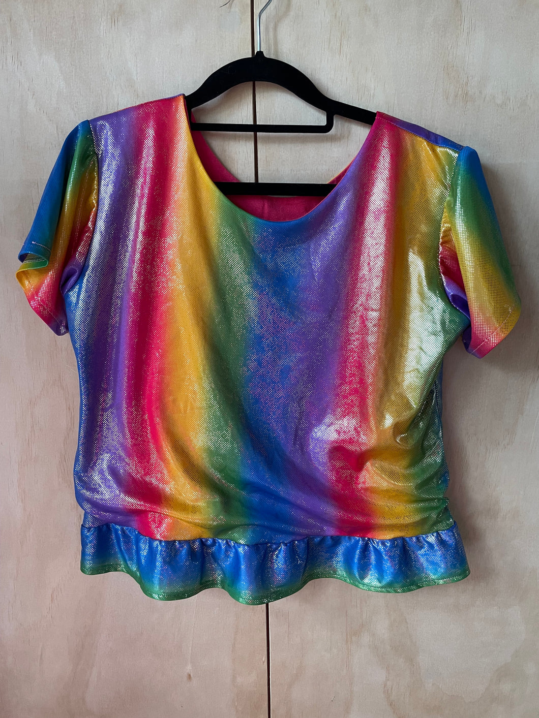 shint rainbow tshirt on clothes hanger