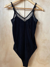 Load image into Gallery viewer, Front of black velvet body suit on hanger
