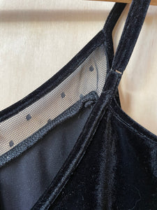 close up of adjustable strap on black velvet bodysuit