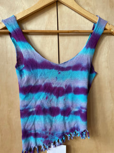 blue and purple womans top on hanger