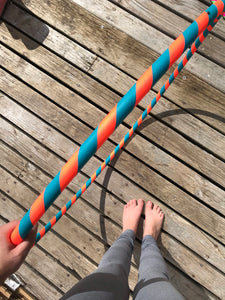 orange and turquoise adult hula hoop for hooop workouts